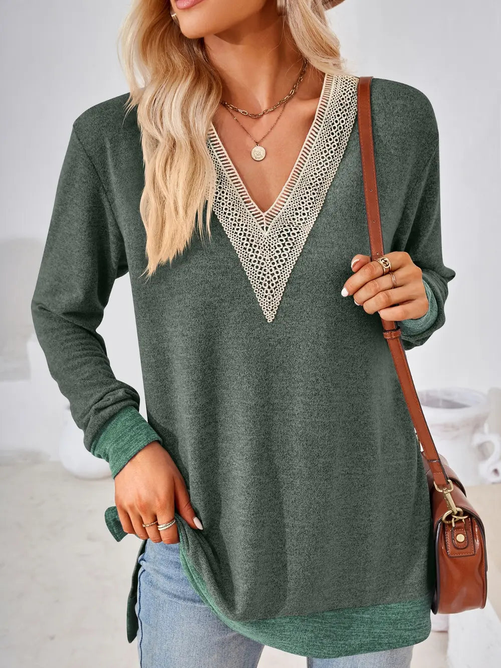 Army green V neck long sleeve top featuring crochet accents and casual relaxed silhouette