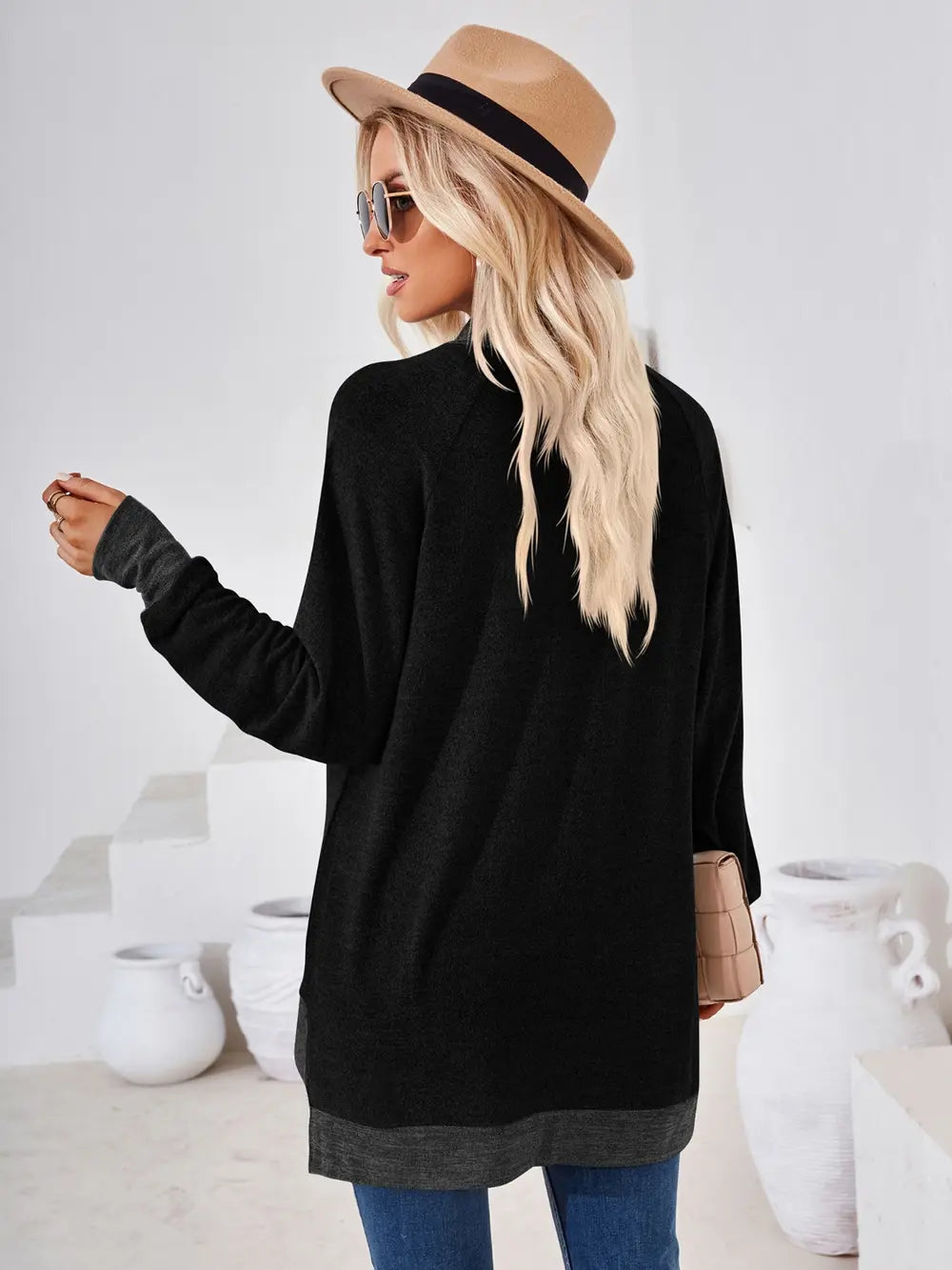Black long sleeve casual top featuring contrast mock neckline and flattering fit