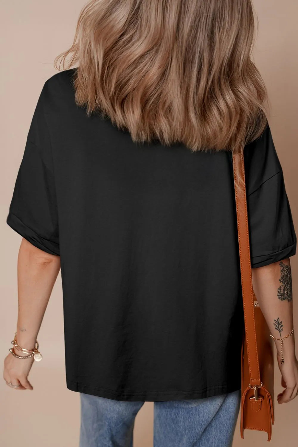 Black hi-low hem loose half sleeve t-shirt front view timeless women's casual top back view