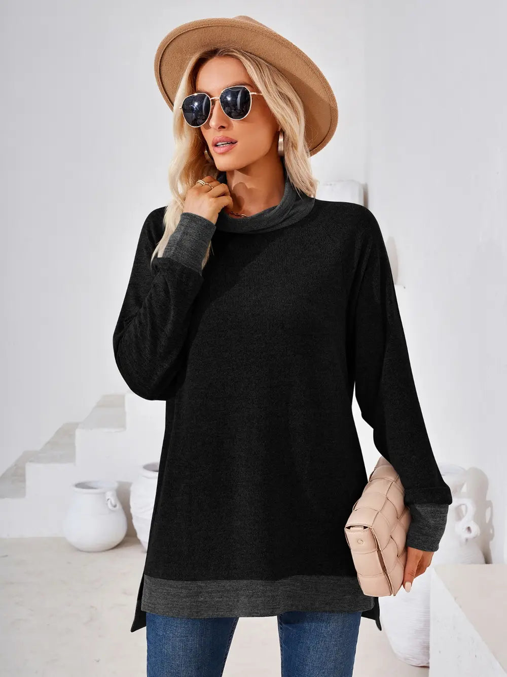 Black long sleeve mock neck top with contrast detailing and modern casual design