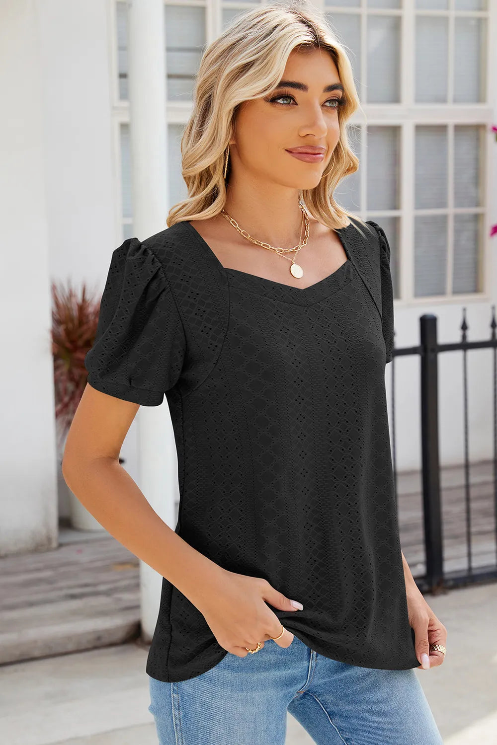 Black eyelet top with short puff sleeves and flattering feminine silhouette