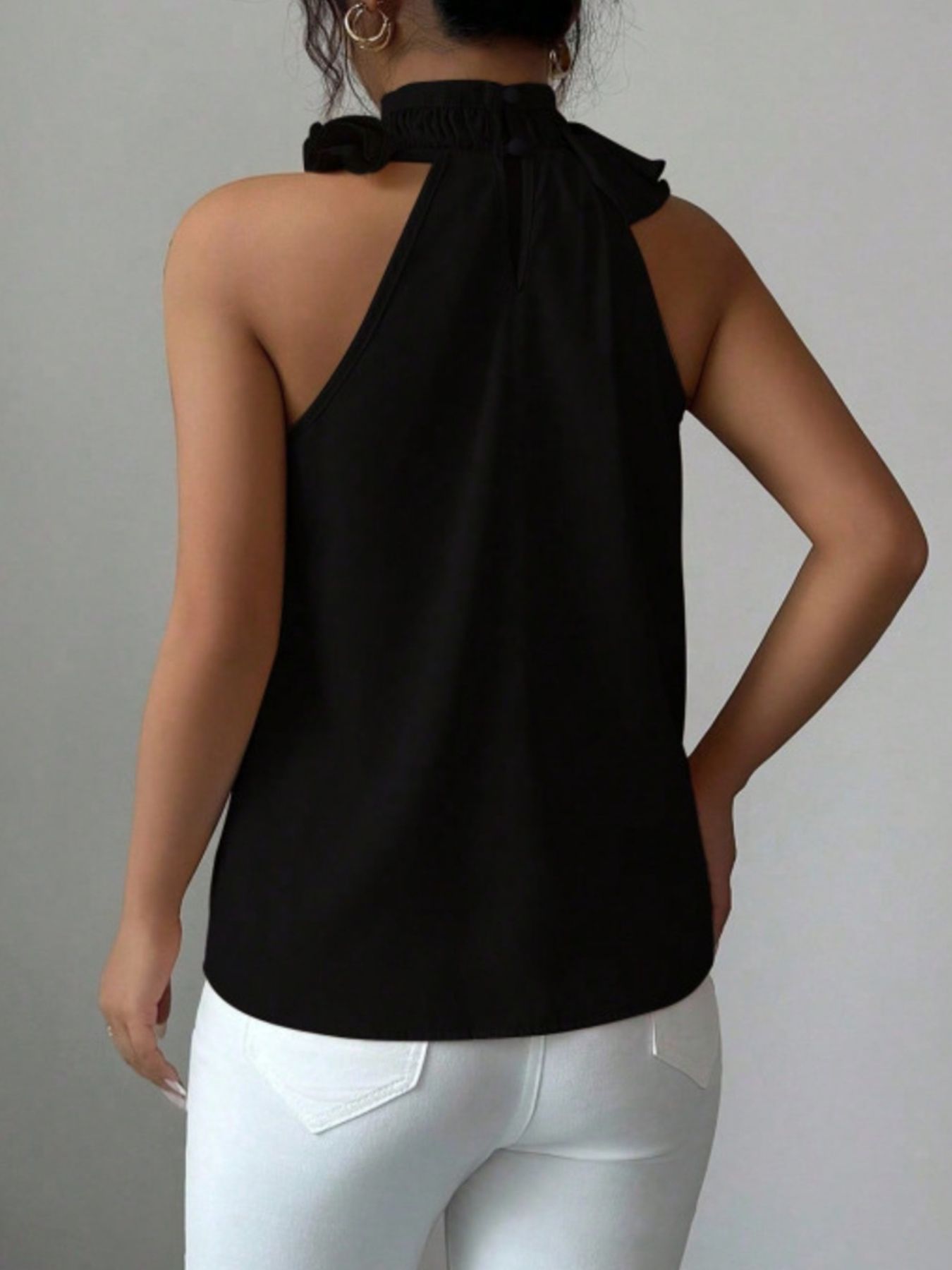 Black sleeveless high neck top back view with clean silhouette and comfortable fit
