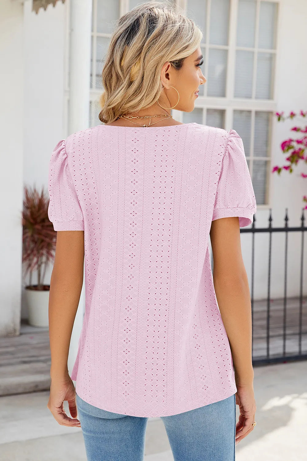 Blush pink broderie anglaise blouse with elegant eyelet detailing and soft silhouette