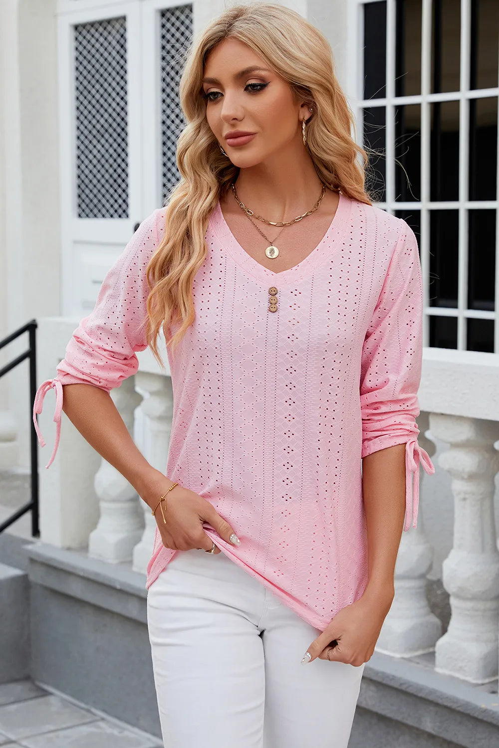Blush pink eyelet top with V neckline, half sleeves and feminine casual styling