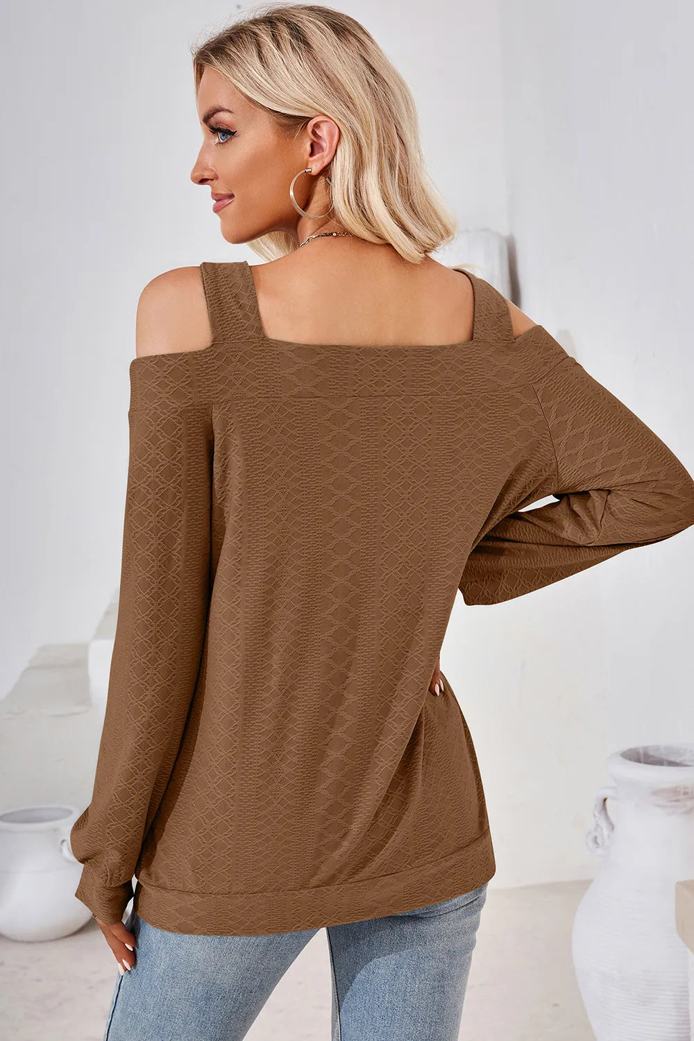 Back view of brown cut out square neck cold shoulder top with elegant long sleeve finish