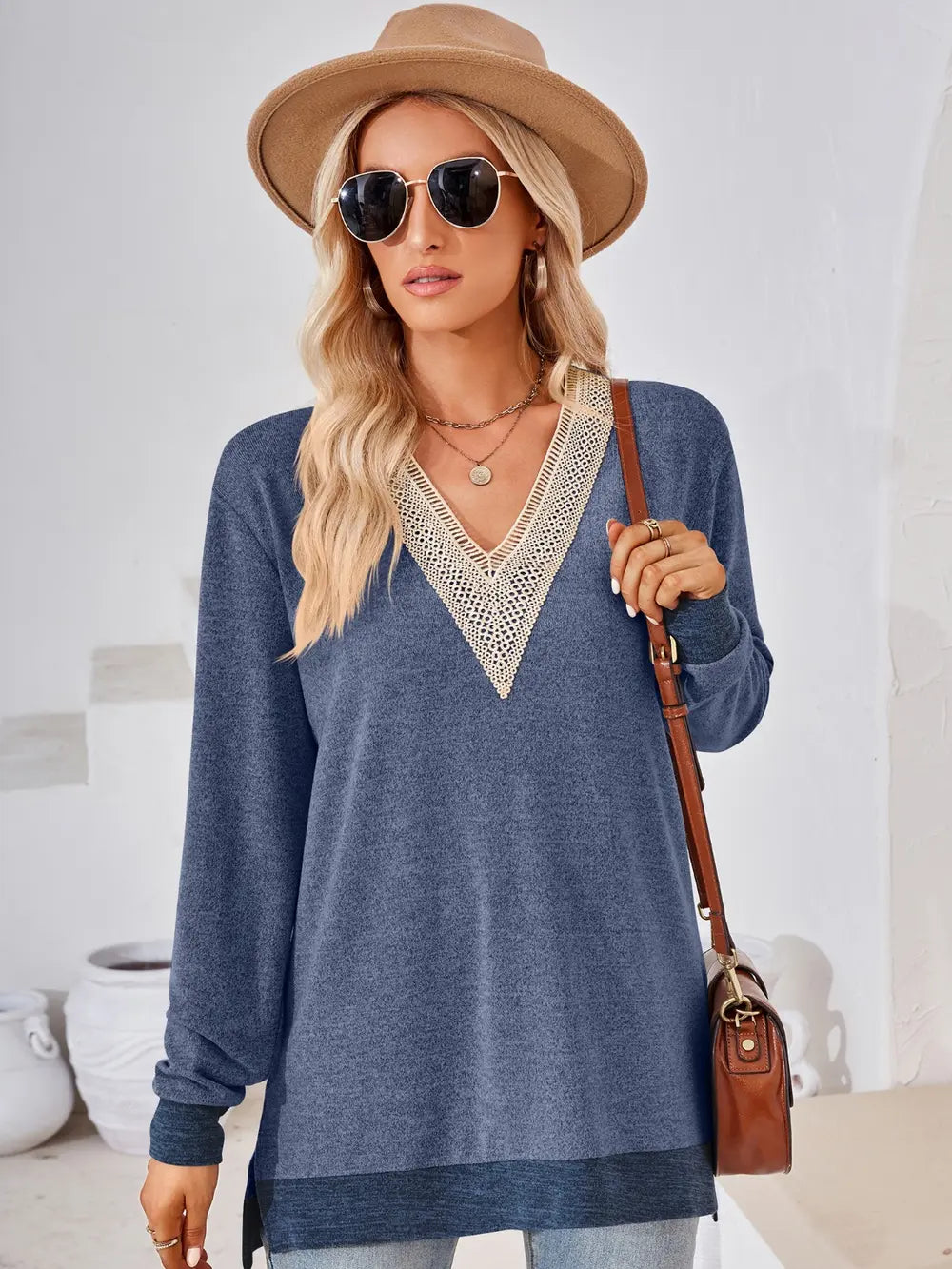 Dusty blue long sleeve top with crochet detailing, side slits and comfortable everyday styling
