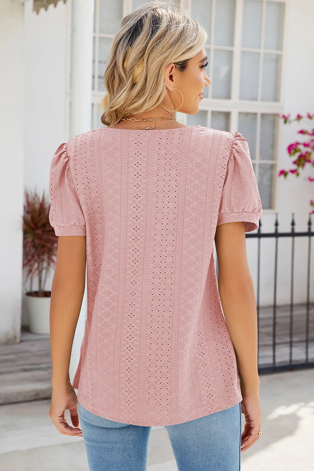 Dusty pink broderie anglaise blouse with intricate eyelet detailing and relaxed fit