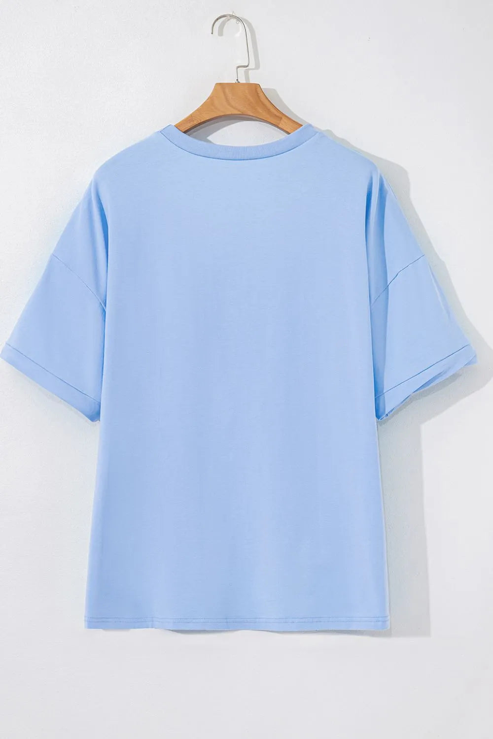 Light blue loose fit half sleeve t-shirt three quarter view versatile women's wardrobe essential