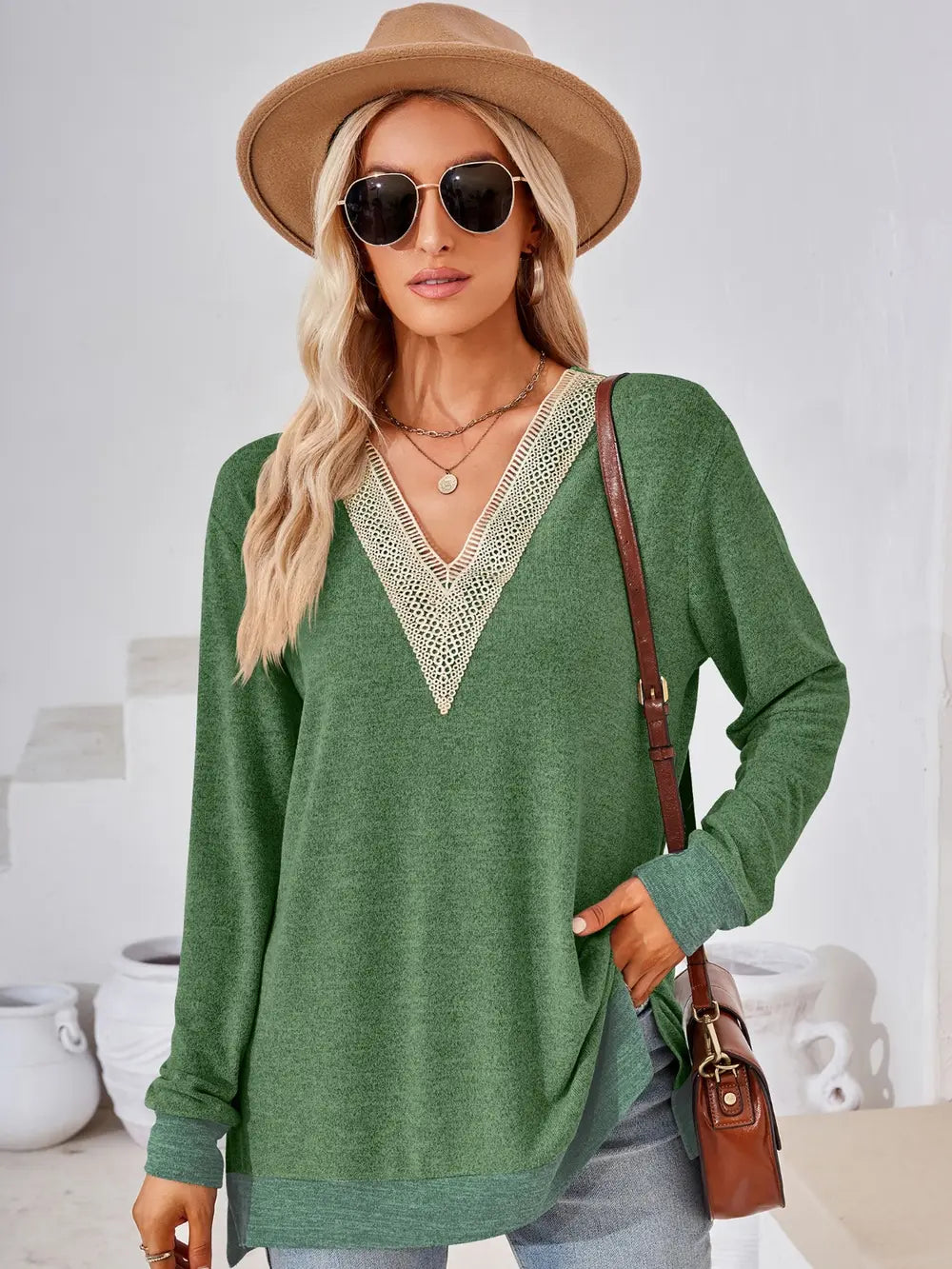Moss green crochet contrast V neck long sleeve top with decorative crochet accents and side slits
