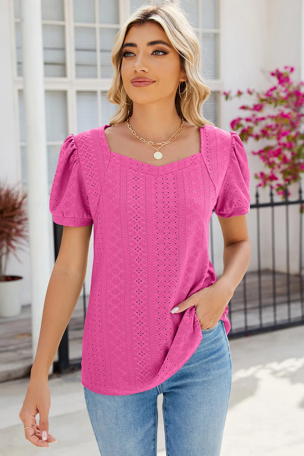 Pink puff sleeve blouse featuring eyelet embroidery and soft lightweight fabric