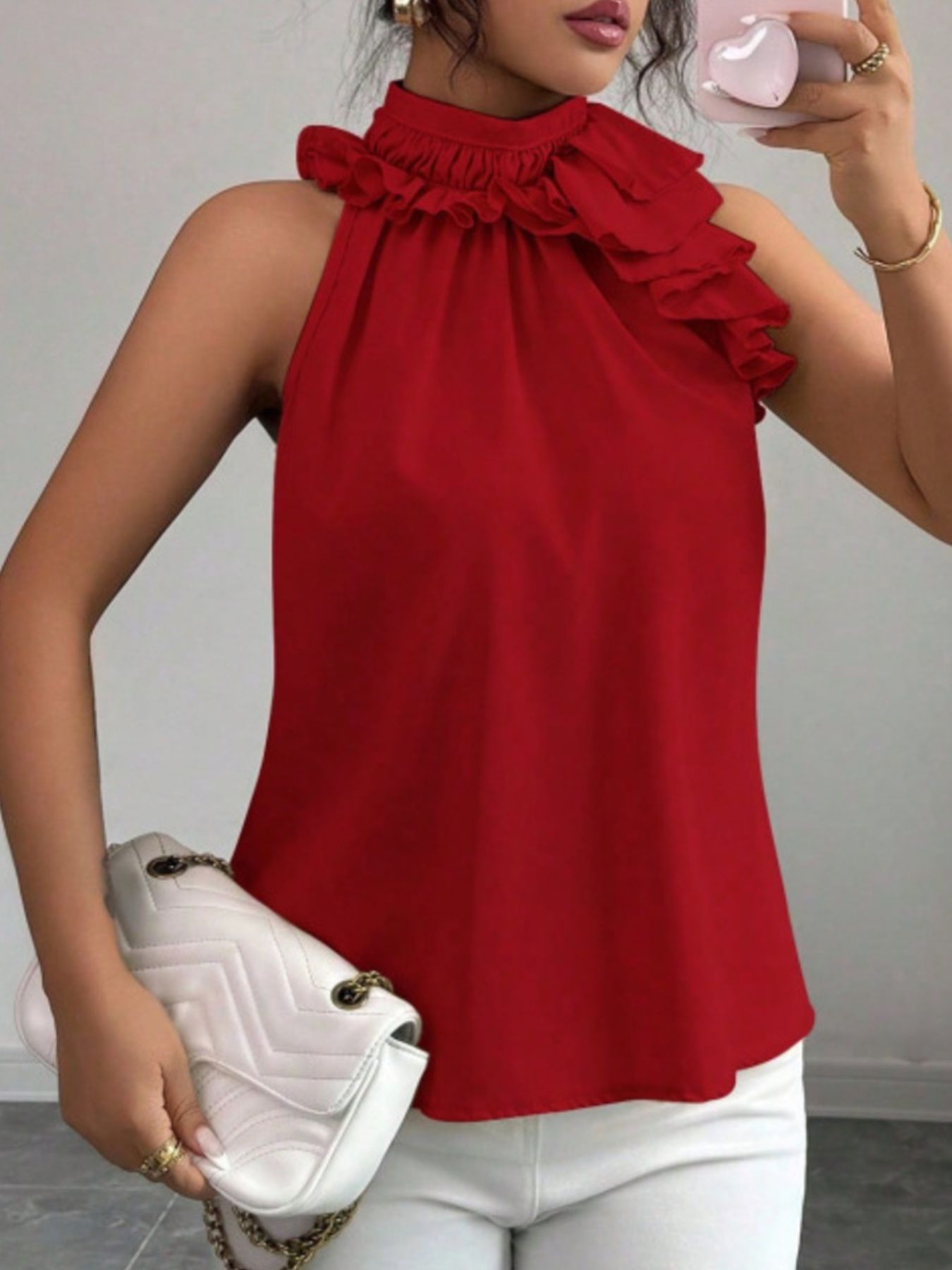 Red sleeveless summer top with high neckline, ruffle trim and flattering tailored fit
