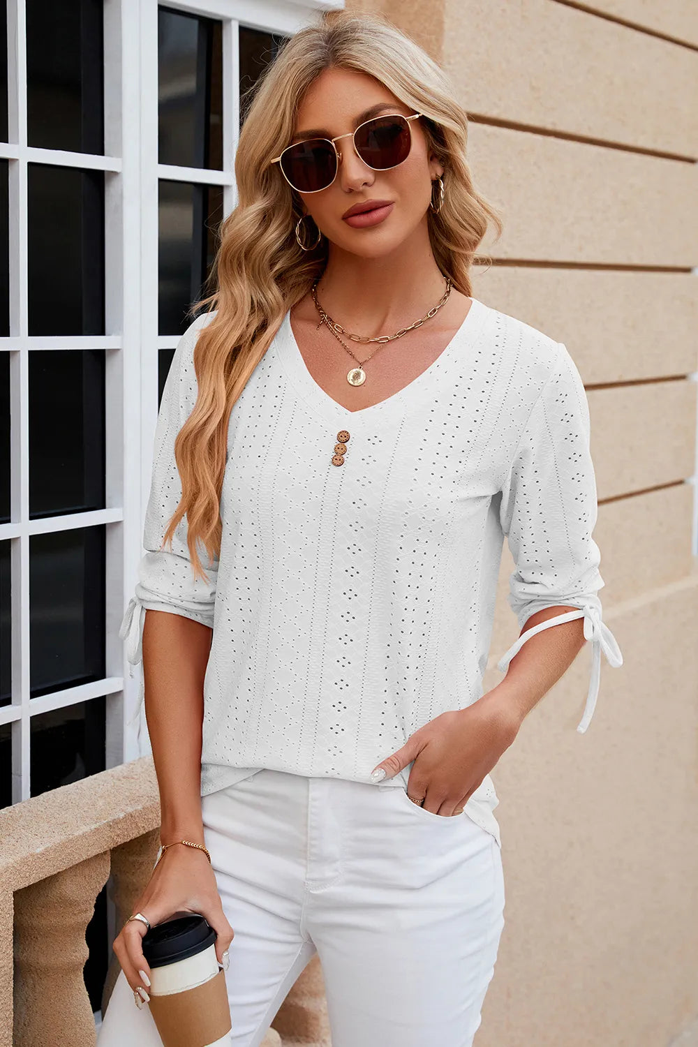 White eyelet drawstring V neck top with half sleeves and classic embroidered design