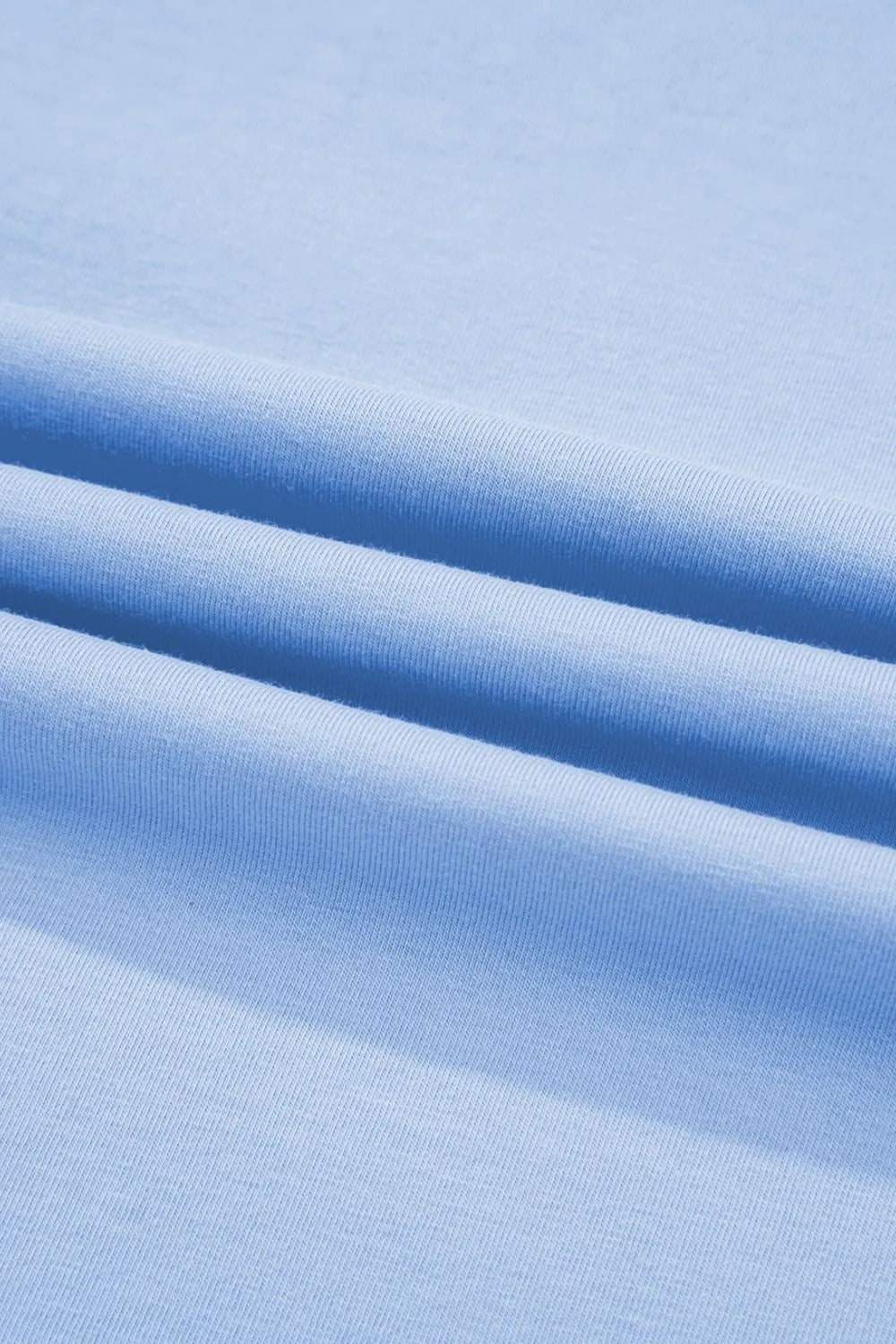 Close-up of blue fabric with a subtle texture