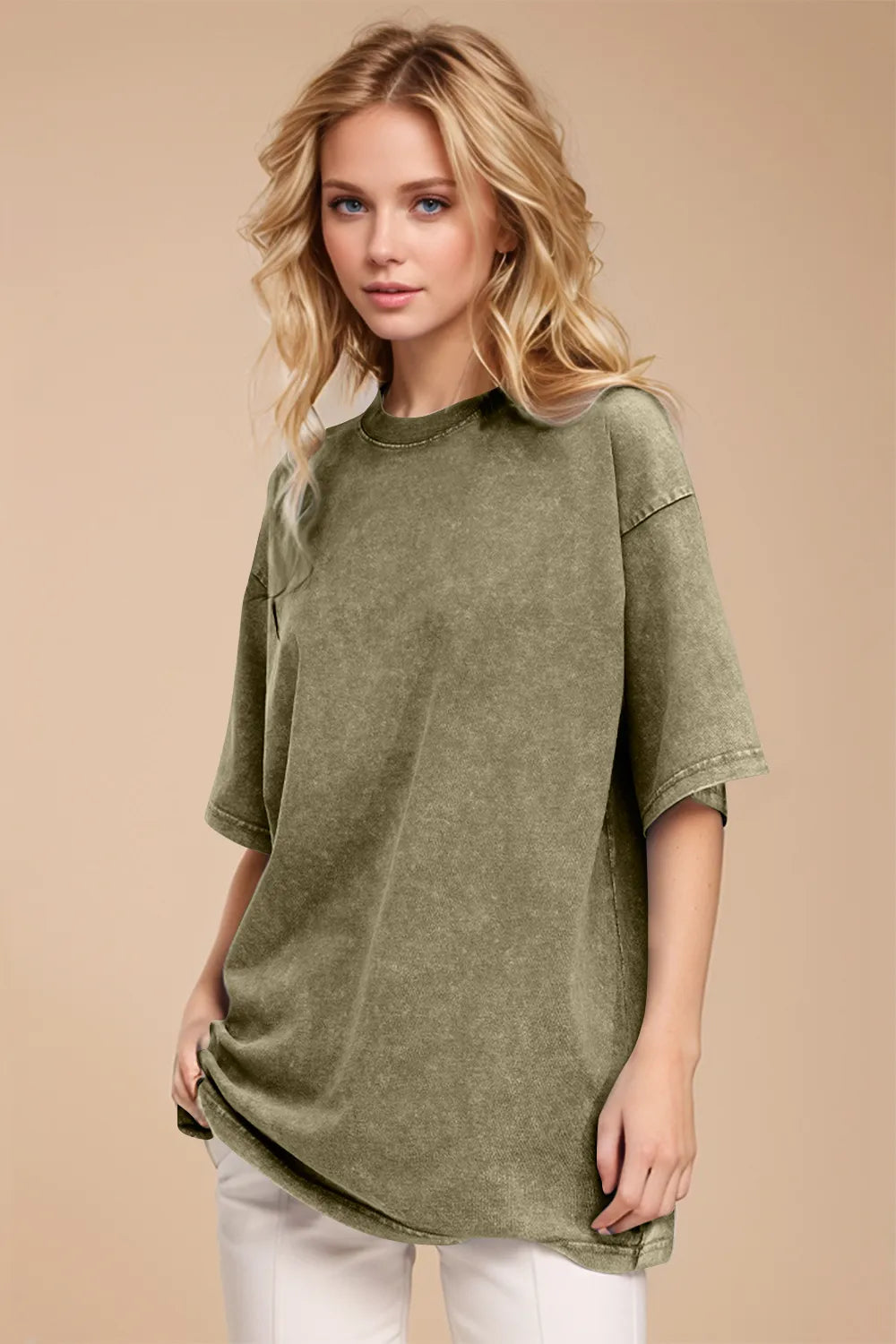 Woman wearing a green oversized shirt against a beige background