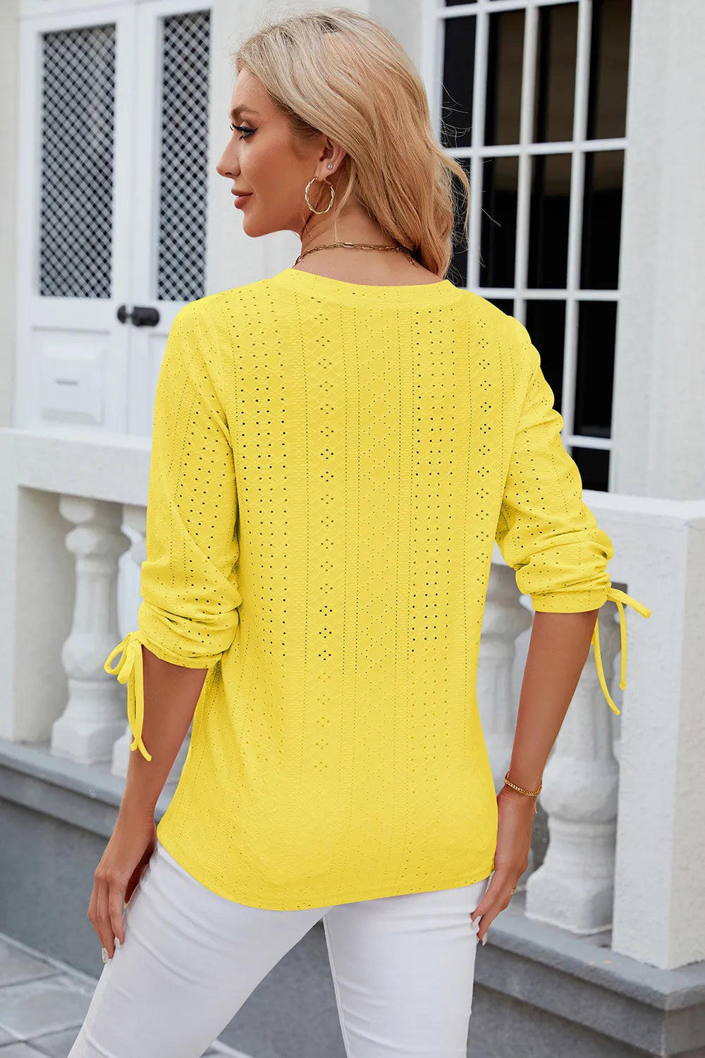 Yellow broderie anglaise top with embroidered eyelet pattern and flattering fit
