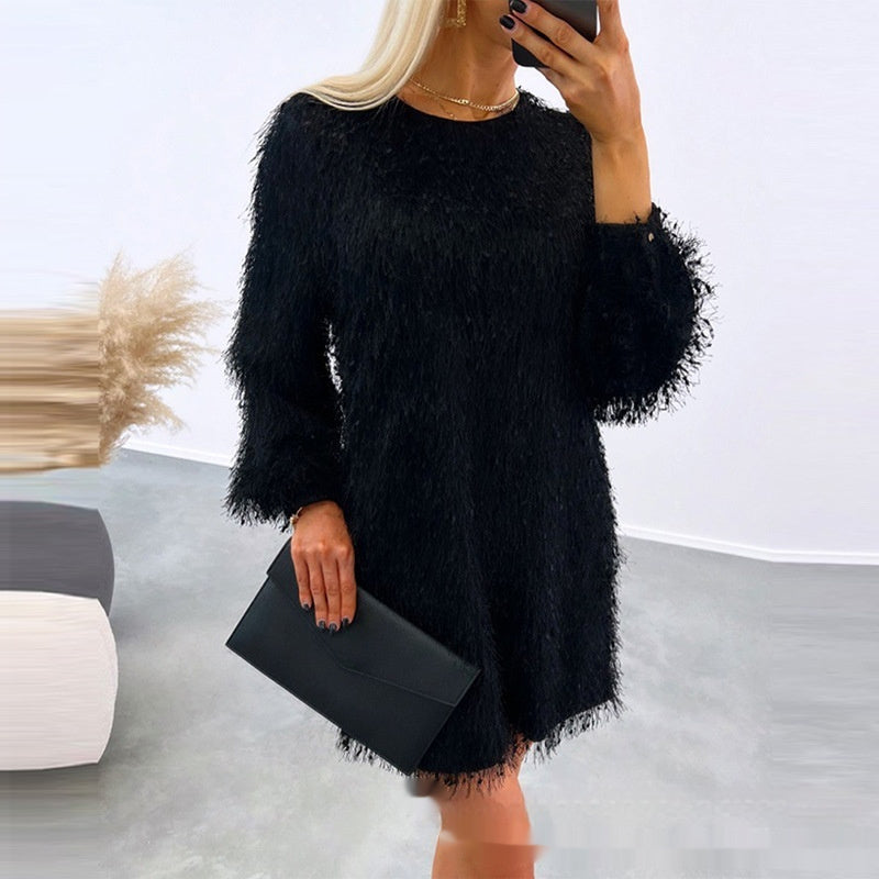 apricot-fuzzy-dress-back-view
Back view of apricot eyelash knit sweater dress showing relaxed straight fit and soft texture

Person wearing a black fluffy dress holding a phone and clutch in an indoor setting.