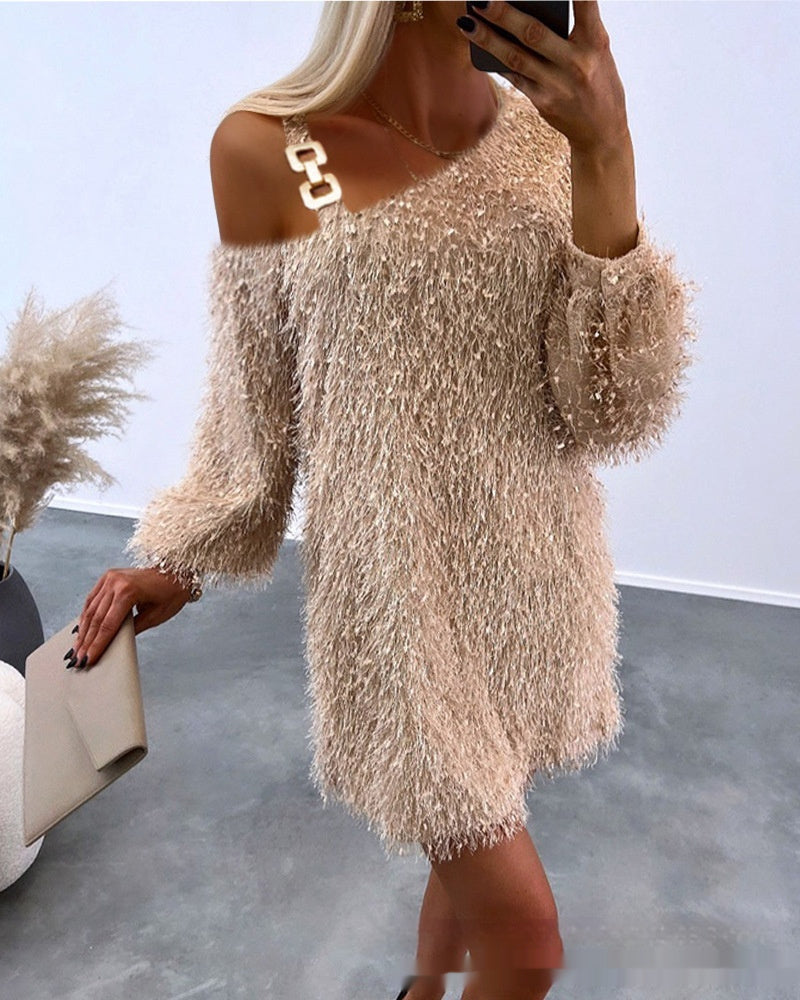 apricot-fuzzy-mini-dress-holiday-heels
Holiday party ready: apricot fuzzy sweater dress styled with black heels and gold accessories

Woman wearing a beige textured dress with a blurred background