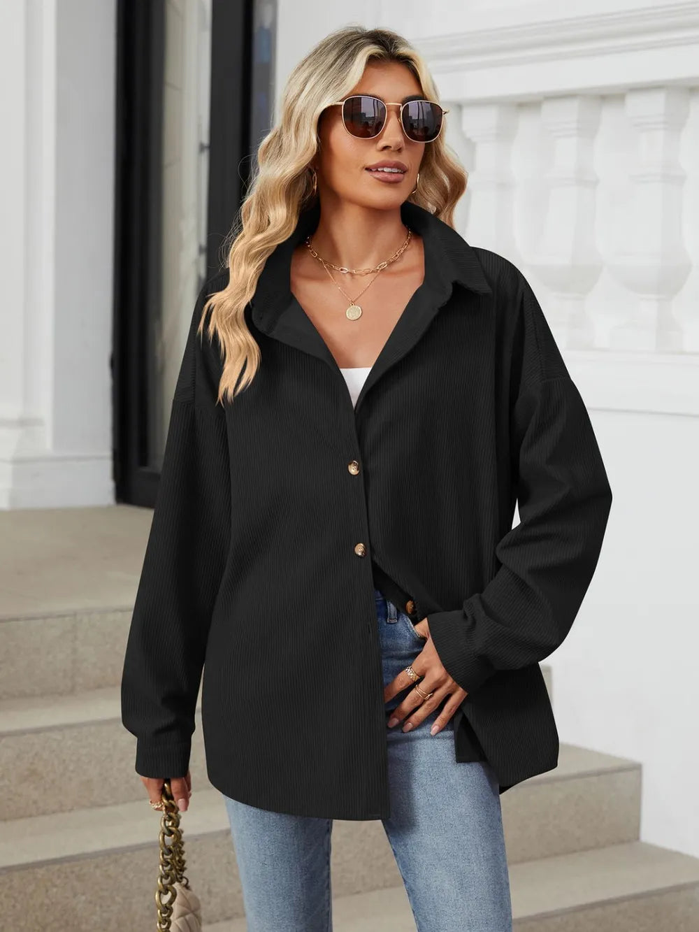Black oversized collared long sleeve shirt side angle showing relaxed casual silhouette