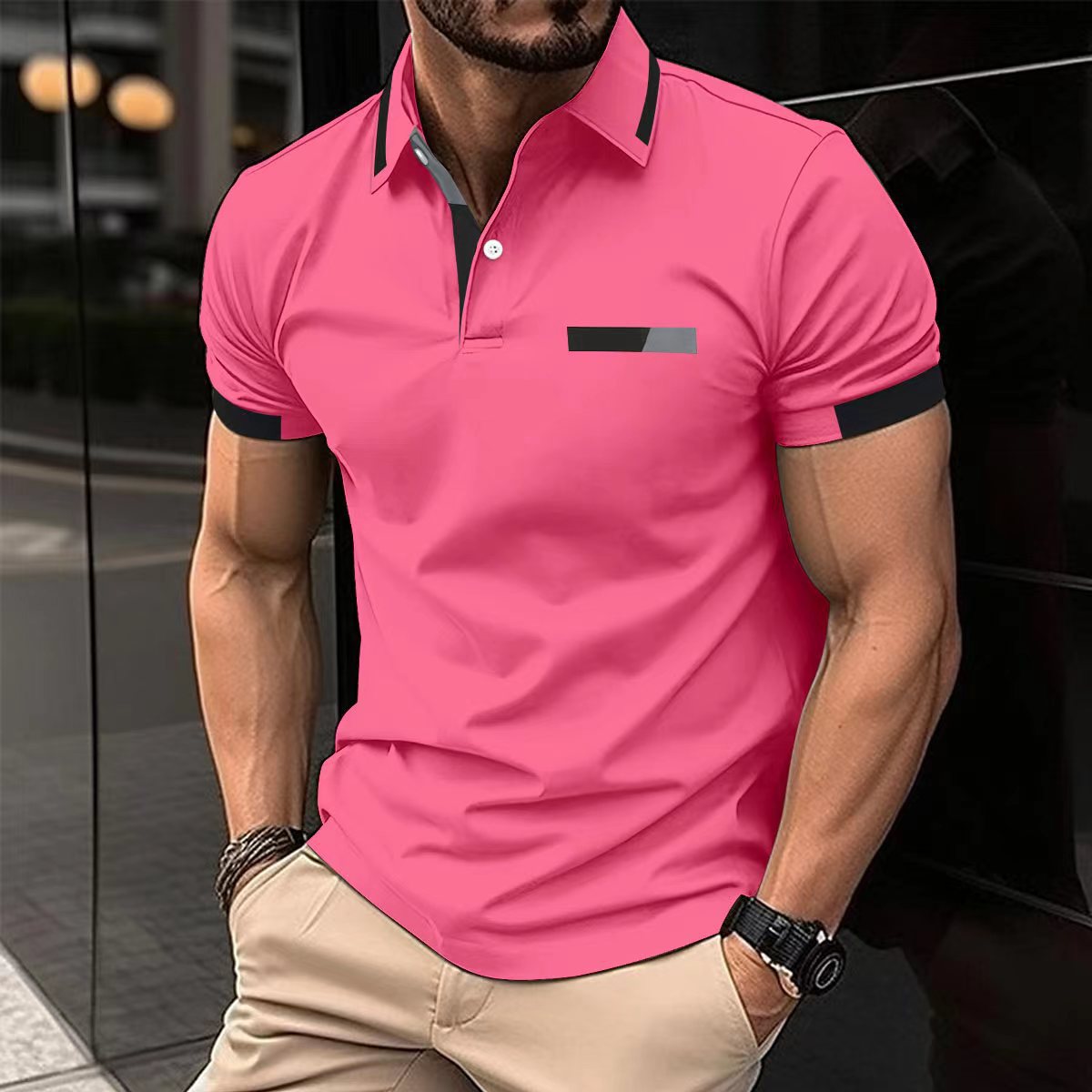 black-polo-shirt-sunglasses-watch
Street style: black polo shirt with sunglasses, watch and slim-fit jeans, modern casual look


Man wearing a pink polo shirt with black accents in an urban setting