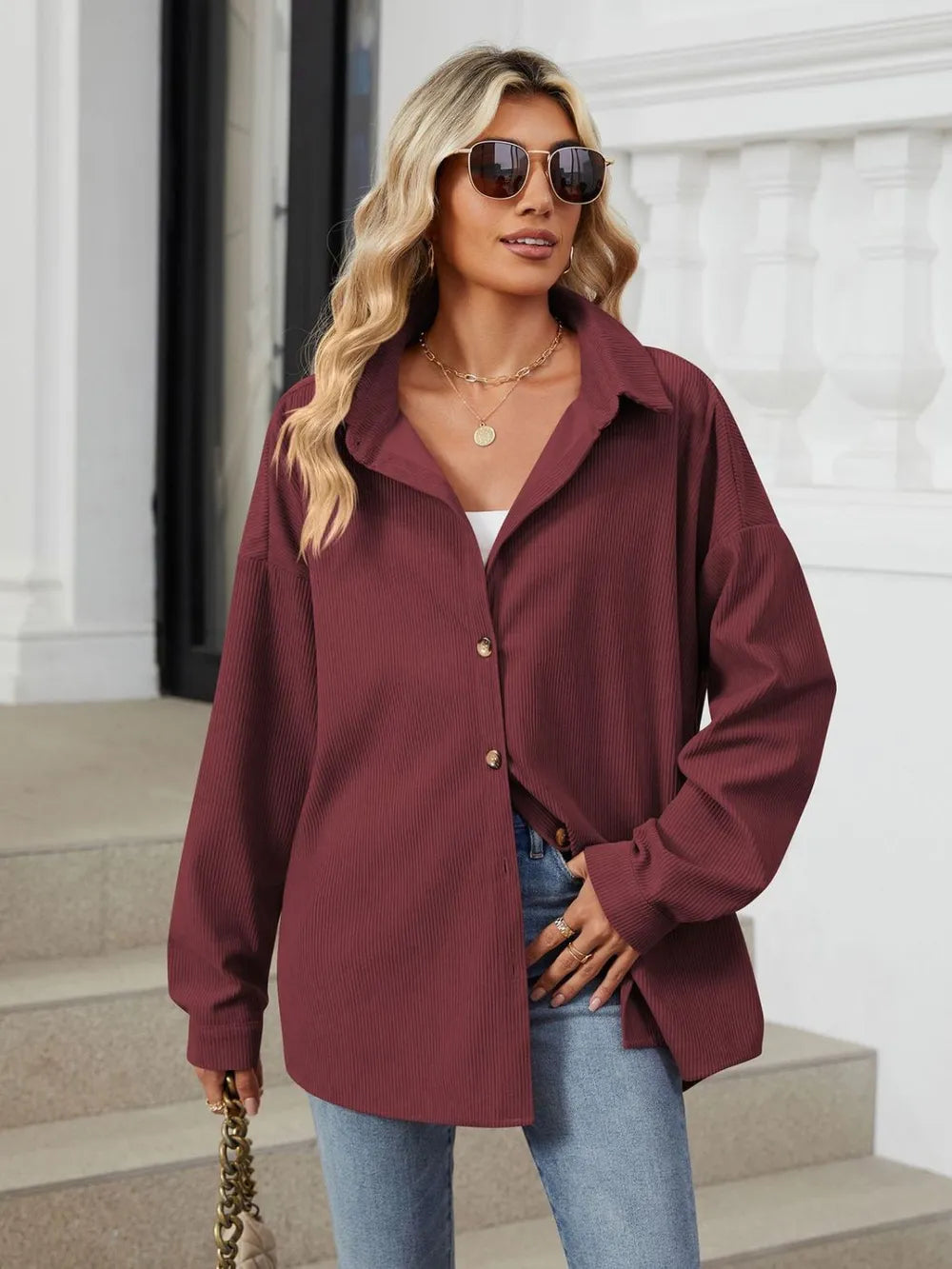 Side angle of burgundy dropped shoulder shirt showcasing relaxed fit and casual styling
