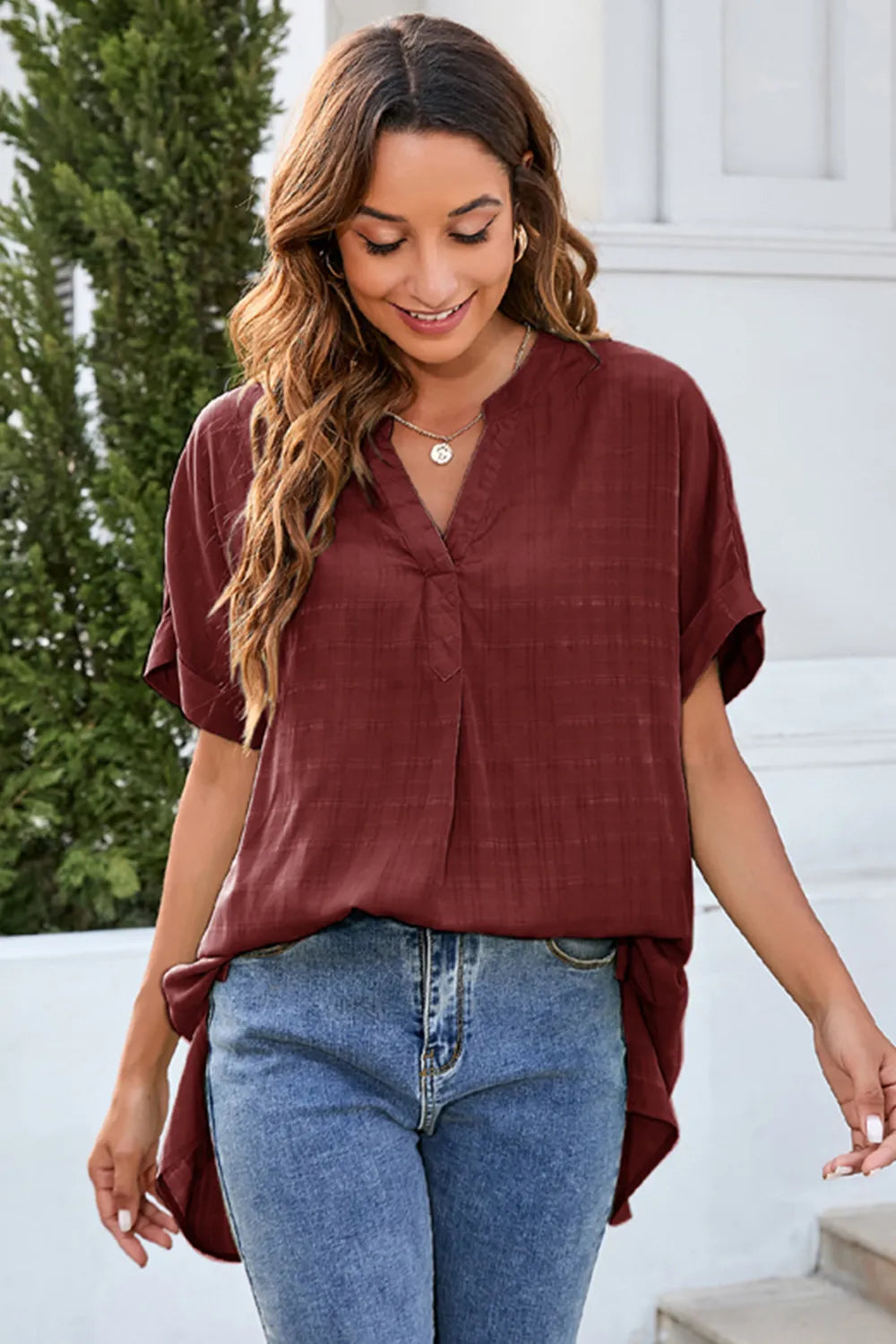 Burgundy notched neck short sleeve blouse styled with jeans casual outfit inspiration