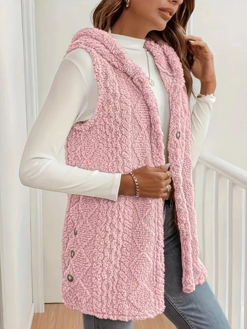 Sherpa vest worn open showing soft plush interior and button placket