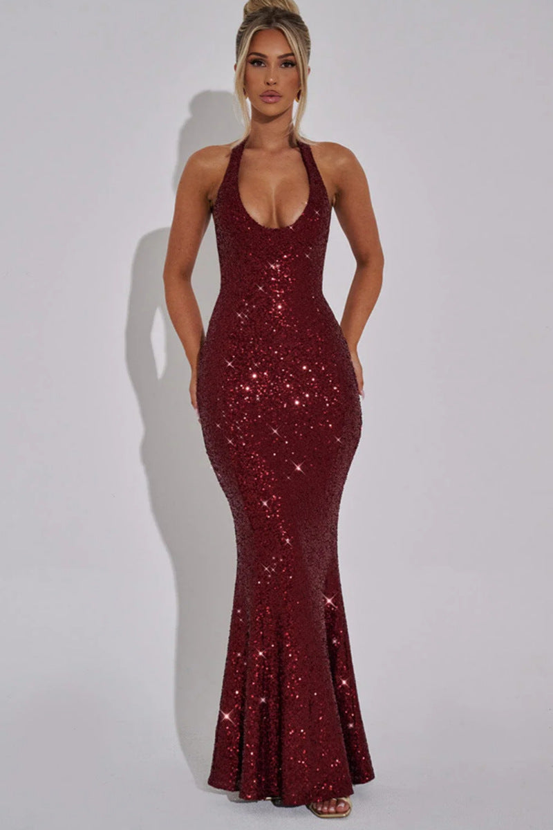 celeste-gold-halter-gown-full-glamour-night
Full nighttime glamour shot of gold Celeste diamond sequin halter maxi gown, pure luxury evening elegance

Woman wearing a burgundy sequin dress against a plain background