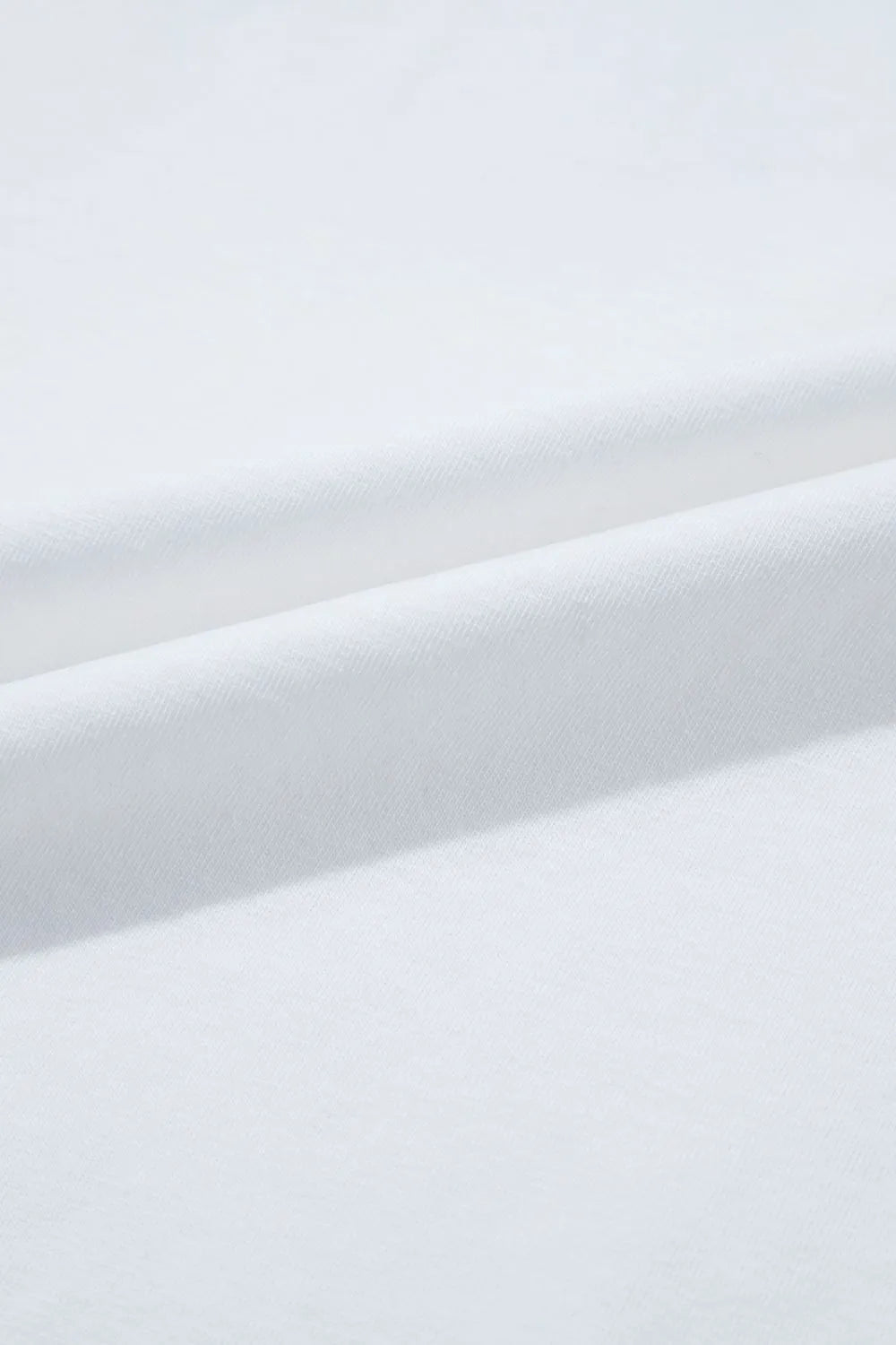 Close-up of white fabric with subtle texture