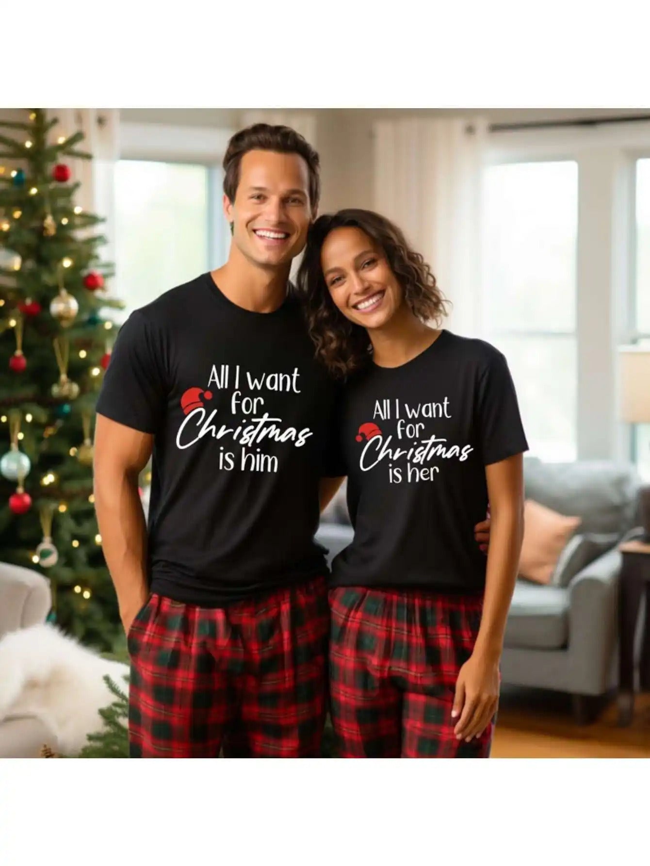 couple-tshirt-valentines-gift-flatlay
Valentine’s gift flat lay: matching his and hers love print couple tees with roses and hearts

Man and woman wearing matching black t-shirts with Christmas-themed text in a living room.