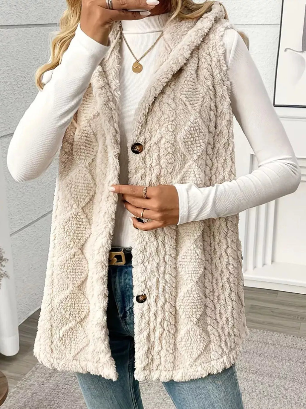 Close-up of ultra-soft sherpa fleece fabric and button detail