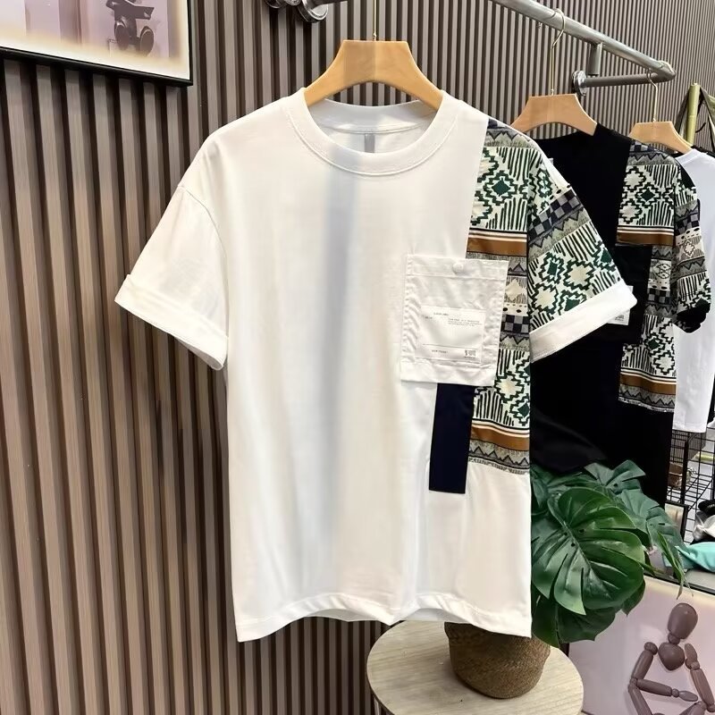 mens-camo-patch-tshirt-white-slim-fit-front
Men’s white slim fit camouflage patch T-shirt with chest pocket, summer street style
White t-shirt with geometric patterned sleeves on a hanger against a striped wall.