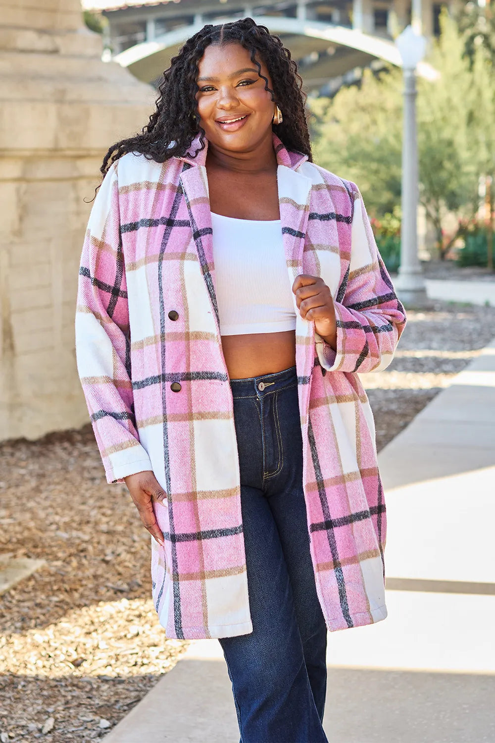 Back view of women’s mid-length pink plaid coat, regular fit