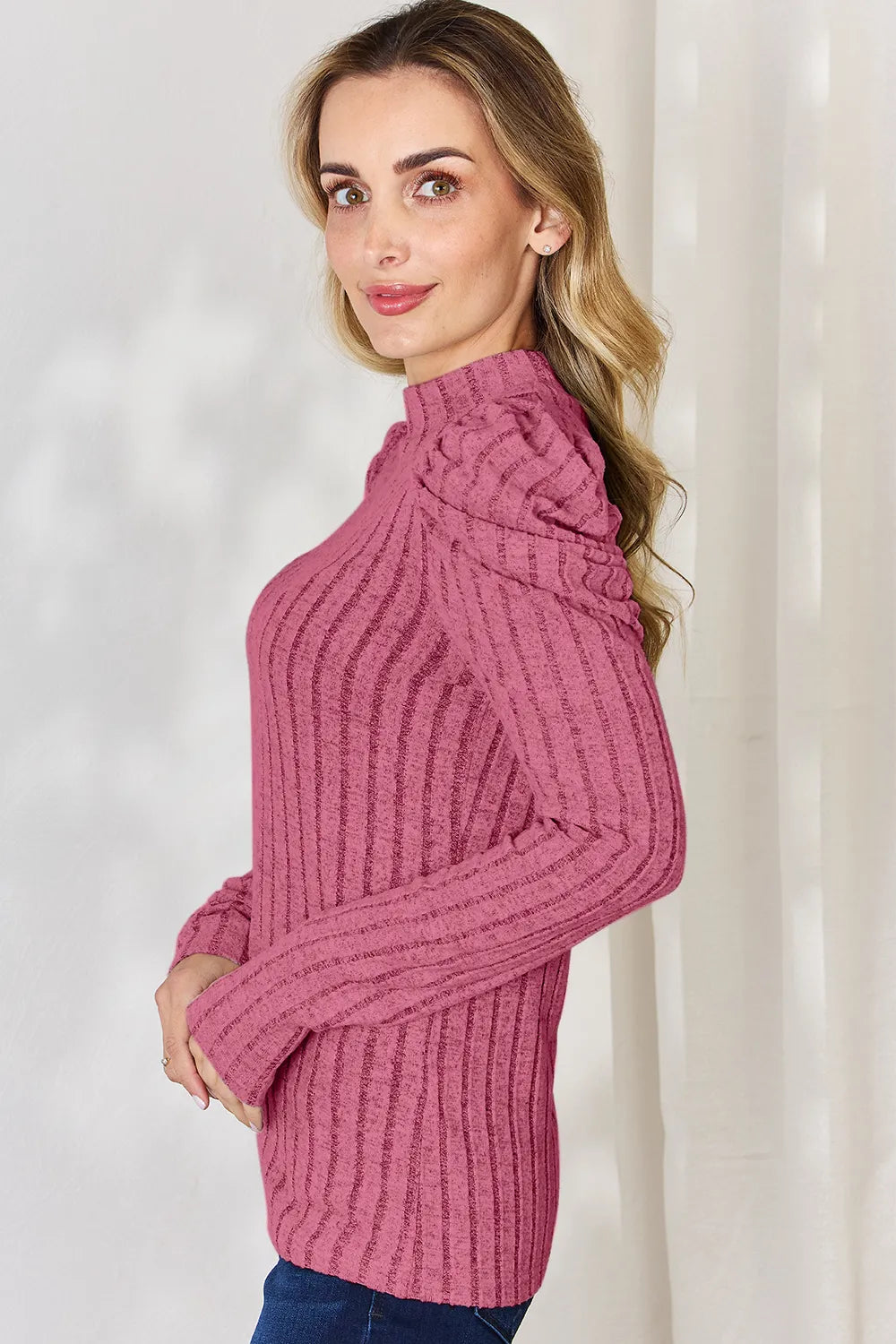 Woman wearing a pink ribbed sweater against a white background mock-neck-ribbed-top-size-chart-overlay
Size reference overlay on ribbed ruched mock neck stretch top