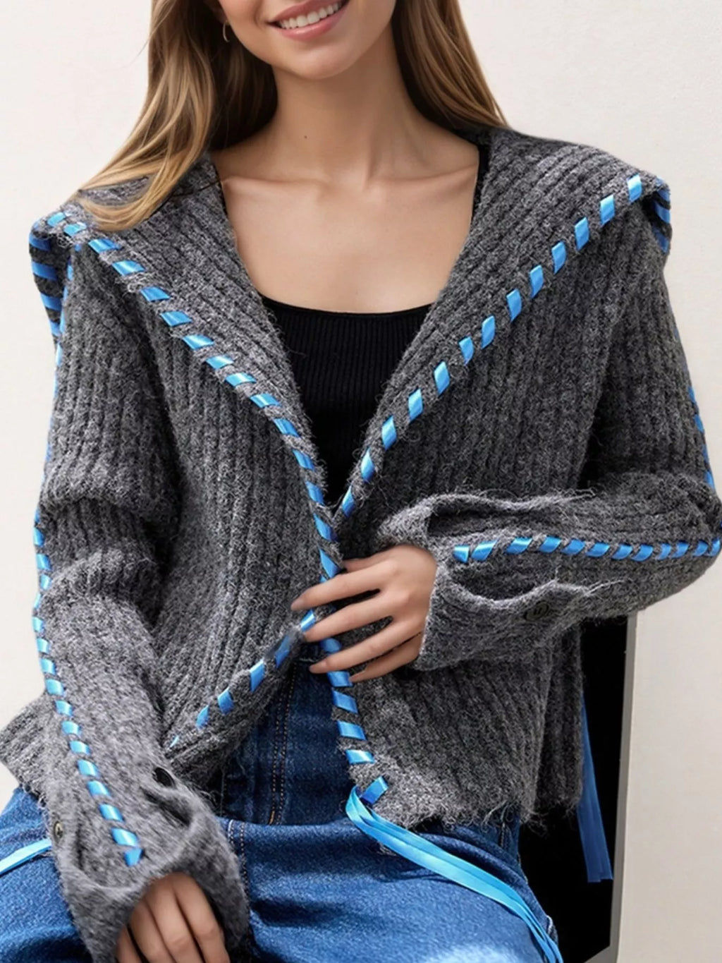 Oversized cable knit cardigan with front buttons and contrast stitching detail