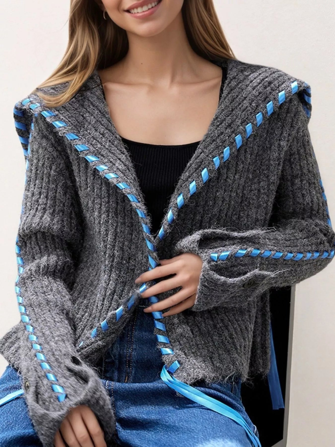 Oversized cable knit cardigan with front buttons and contrast stitching detail