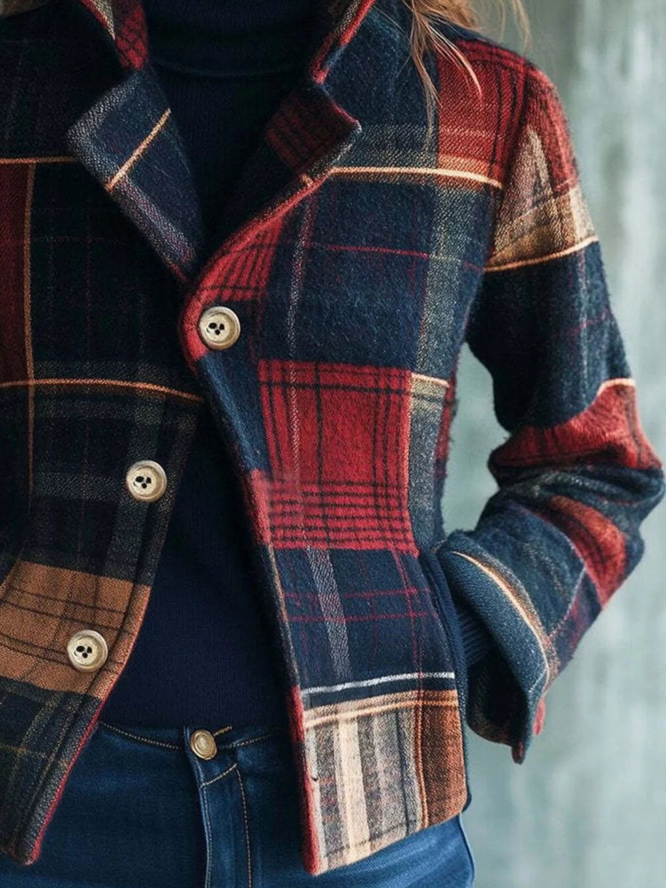 Woman wearing oversized plaid shacket over white tee and jeans – effortless casual fall outfit