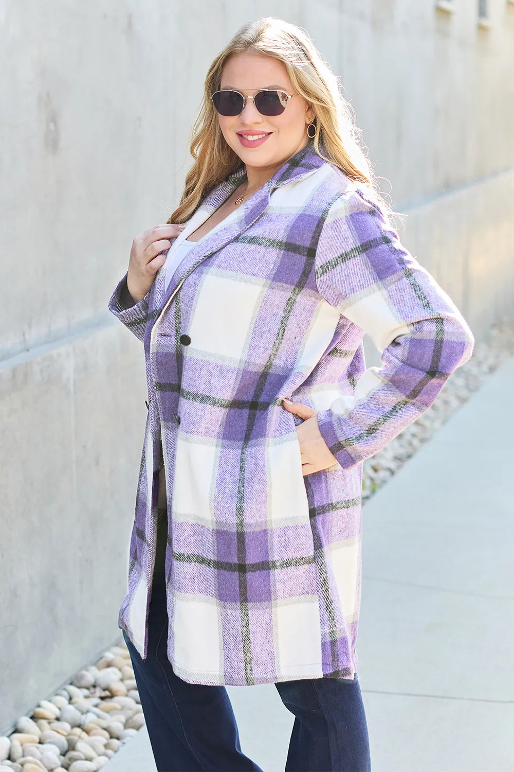 Cute café look wearing pink plaid jacket over sweater

