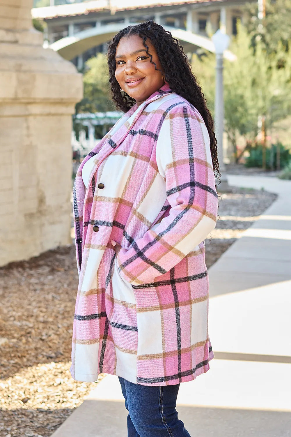 Fall outfit with pink plaid shacket, black leggings and ankle boots
