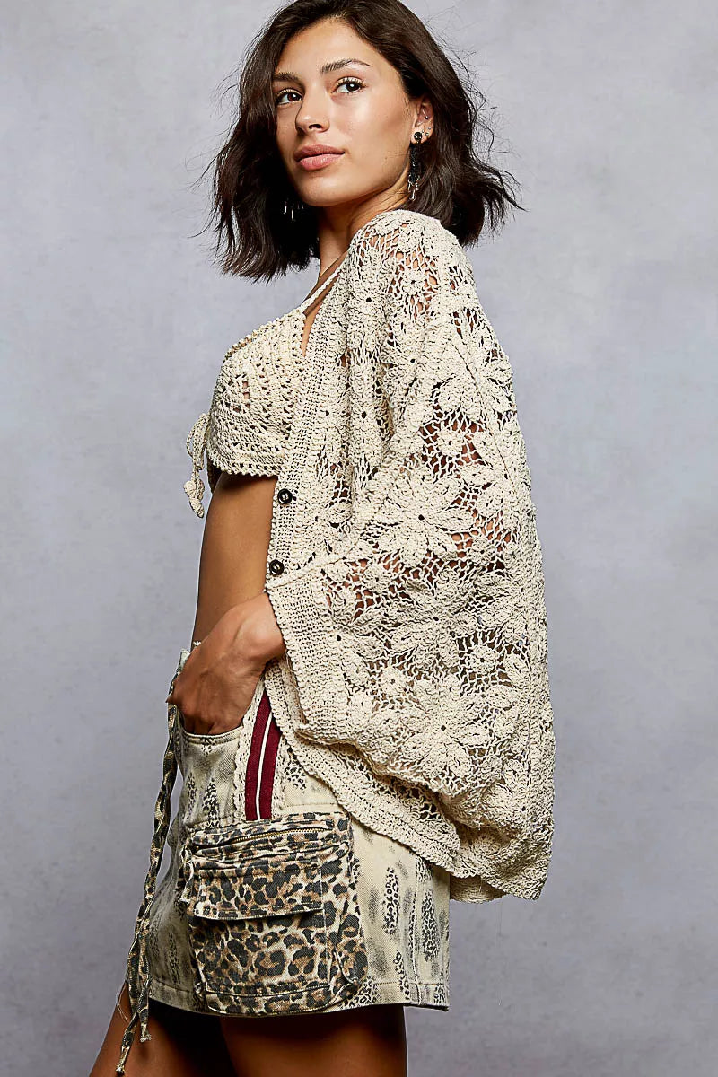 Woman wearing POL Crochet Knit Lightweight Cardigan with pockets and drawstring tie, perfect for festival outfits and casual summer layering