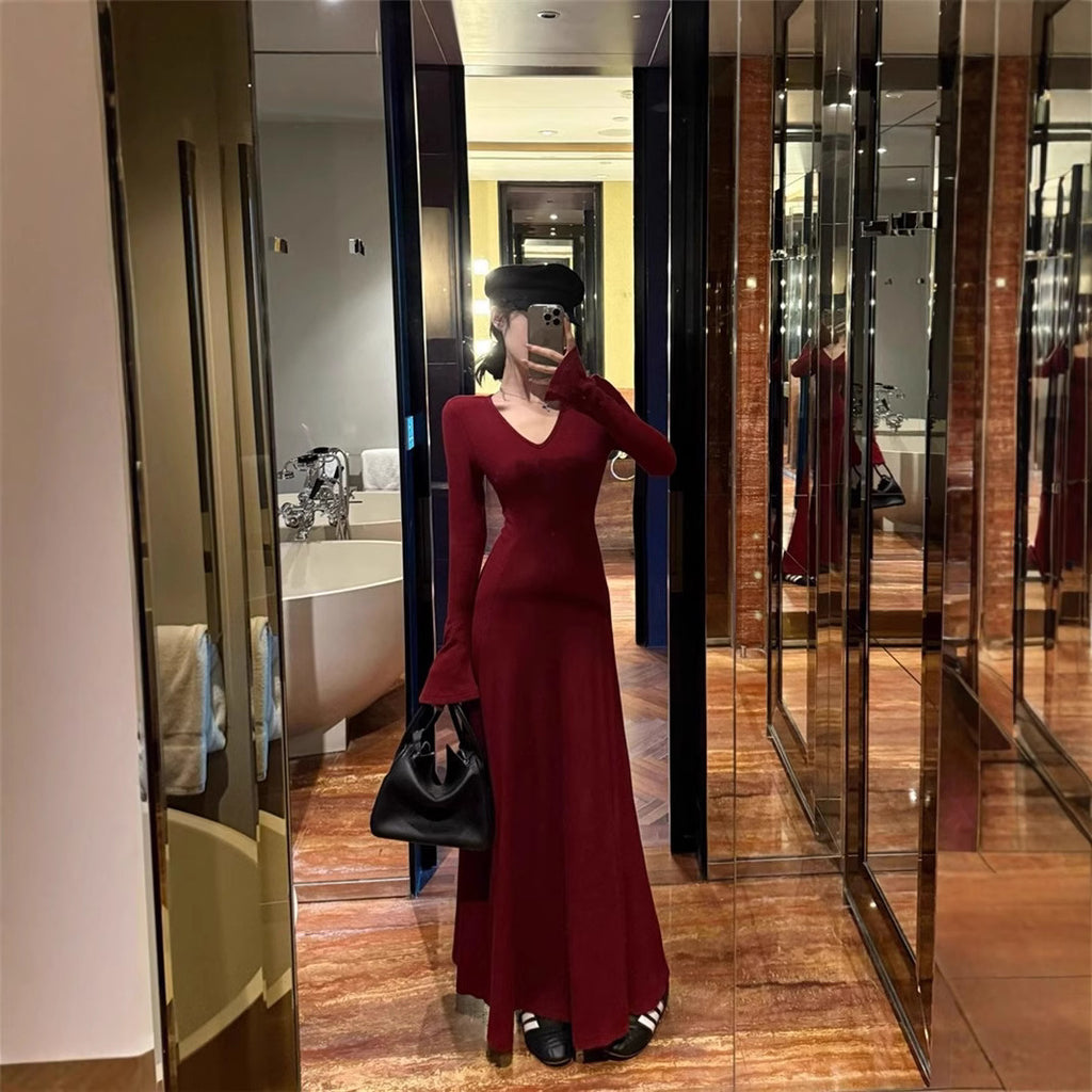 red-long-sleeve-maxi-back-view
Back view of red ribbed maxi dress showing flared hem and flattering cinched waist silhouette

Person wearing a red dress in a fitting room with mirrors.