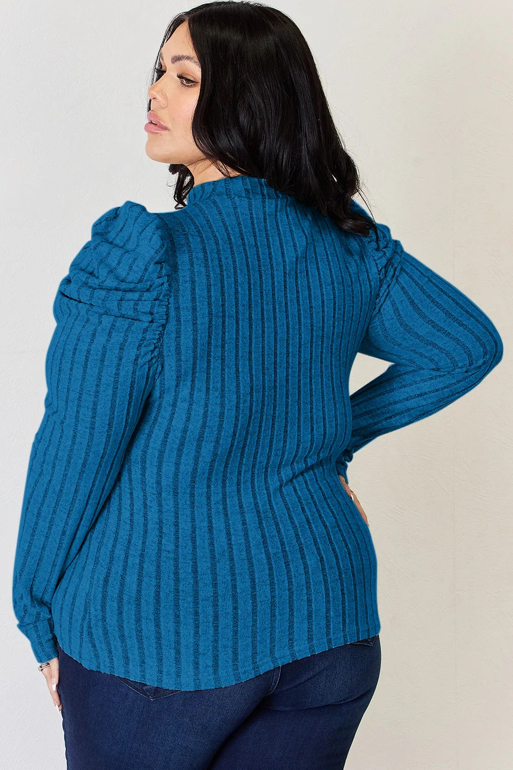 Evening look: ribbed ruched top with heels and statement earrings