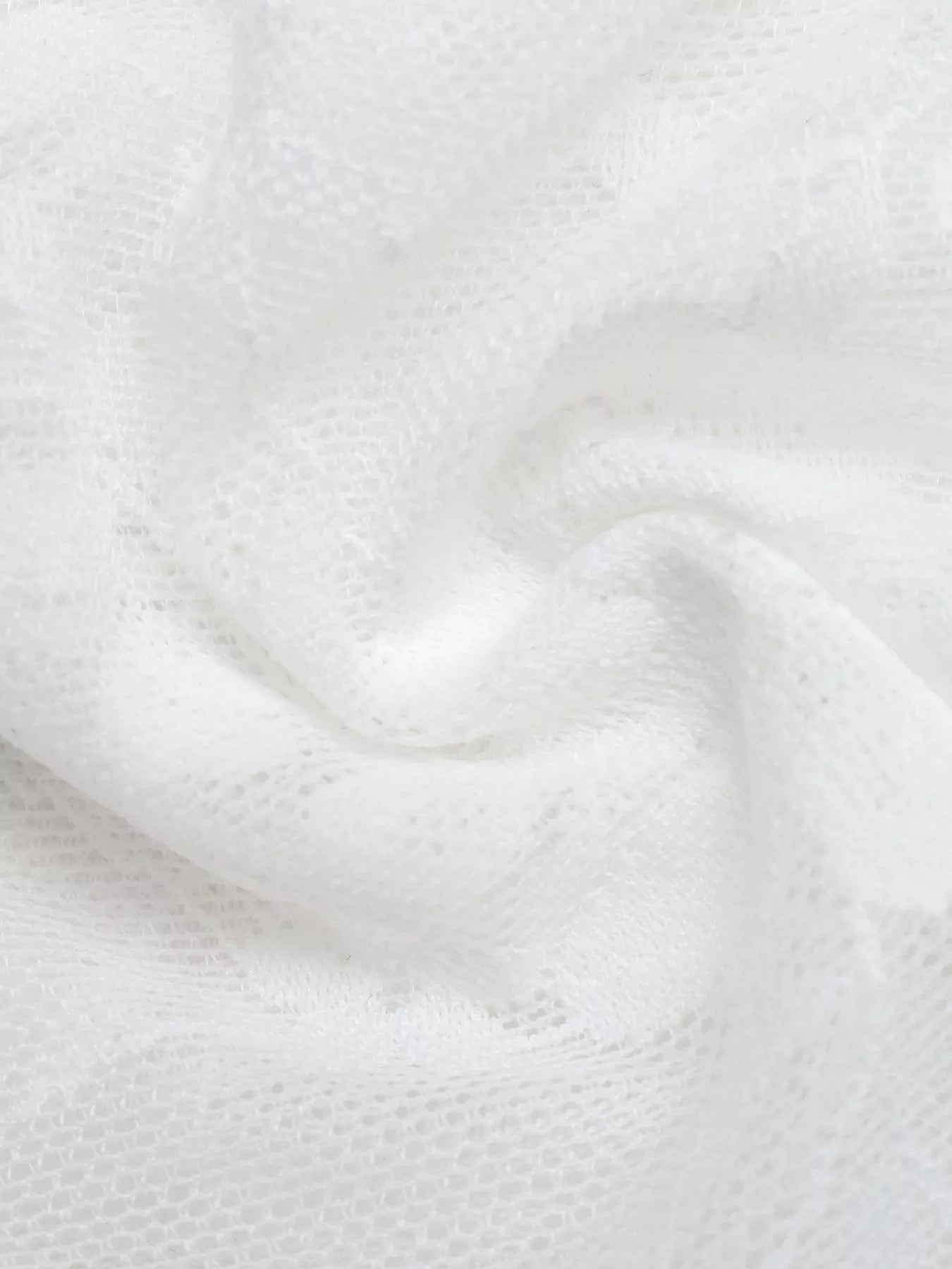 Close-up of white fabric with a textured pattern