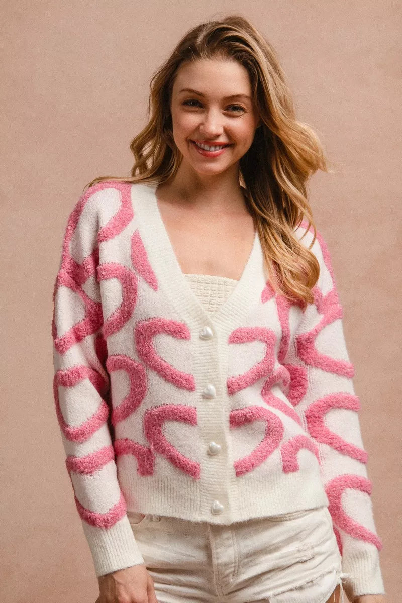 Pink textured heart button cardigan with V-neck and cute heart-shaped buttons