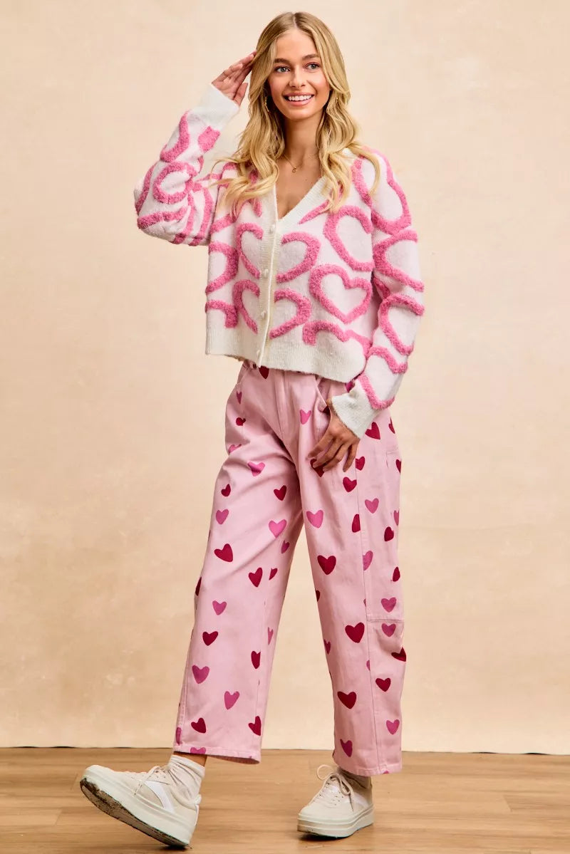 Textured heart cardigan worn open as lightweight layering piece over cami