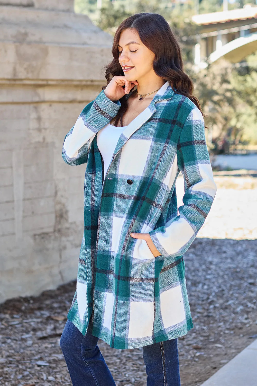 Travel styling: pink plaid jacket over hoodie with sneakers