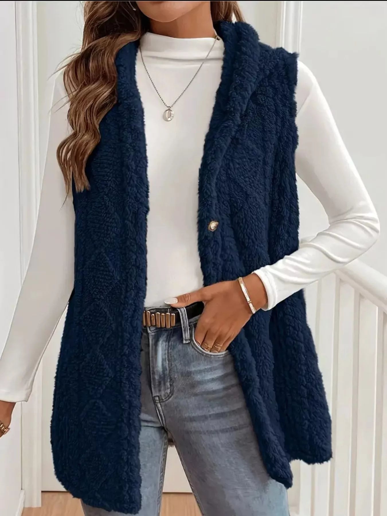 Casual weekend look wearing hooded sherpa vest with leggings and boots